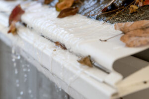 Image of a DIY reverse-curve gutter guard on a roof.