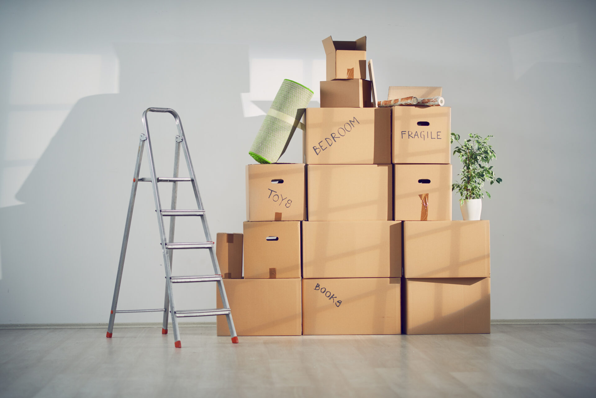 Piled up moving boxes in new apartment