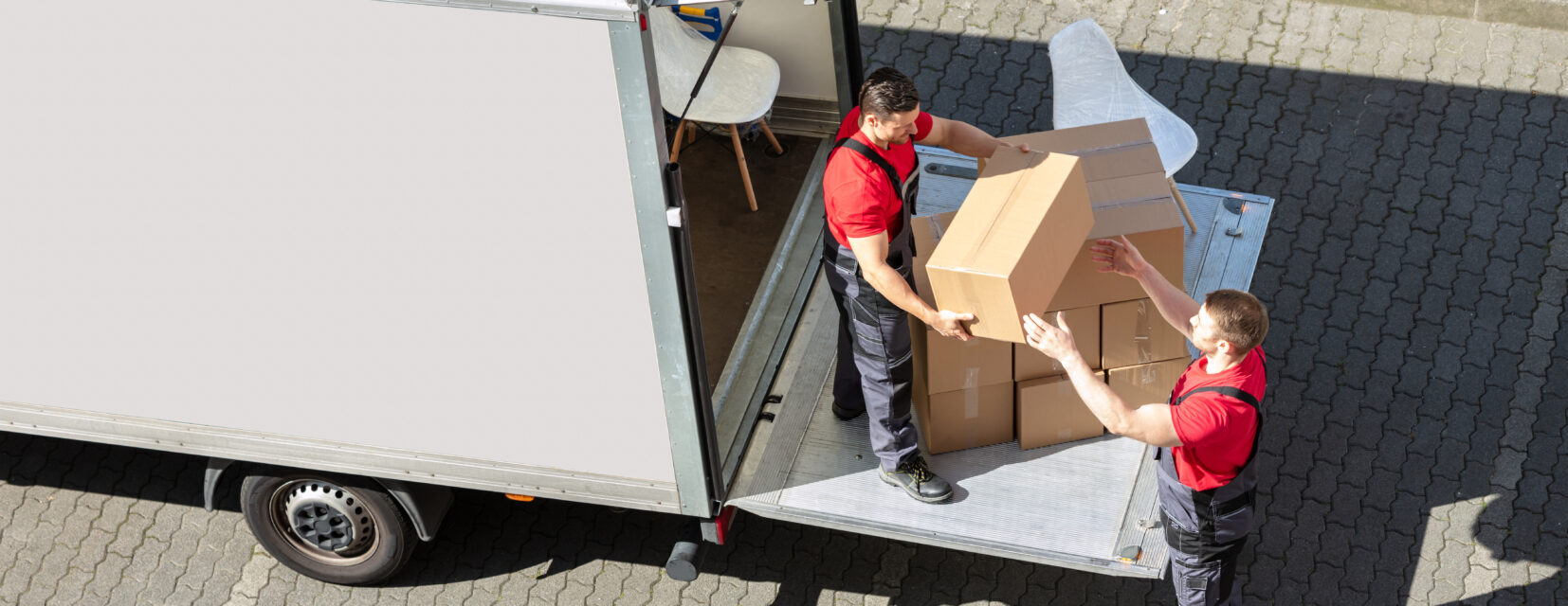 professional movers loading their moving truck