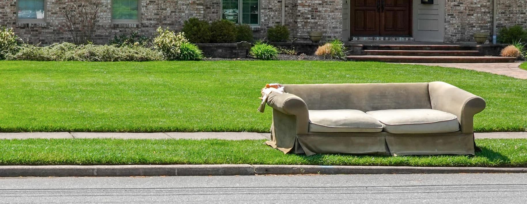 Couch on the side of the road for junk removal