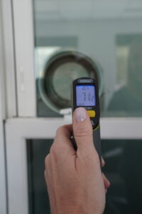 Infrared thermometer gun reading temperature through Champion window at 71.2 degrees Fahrenheit