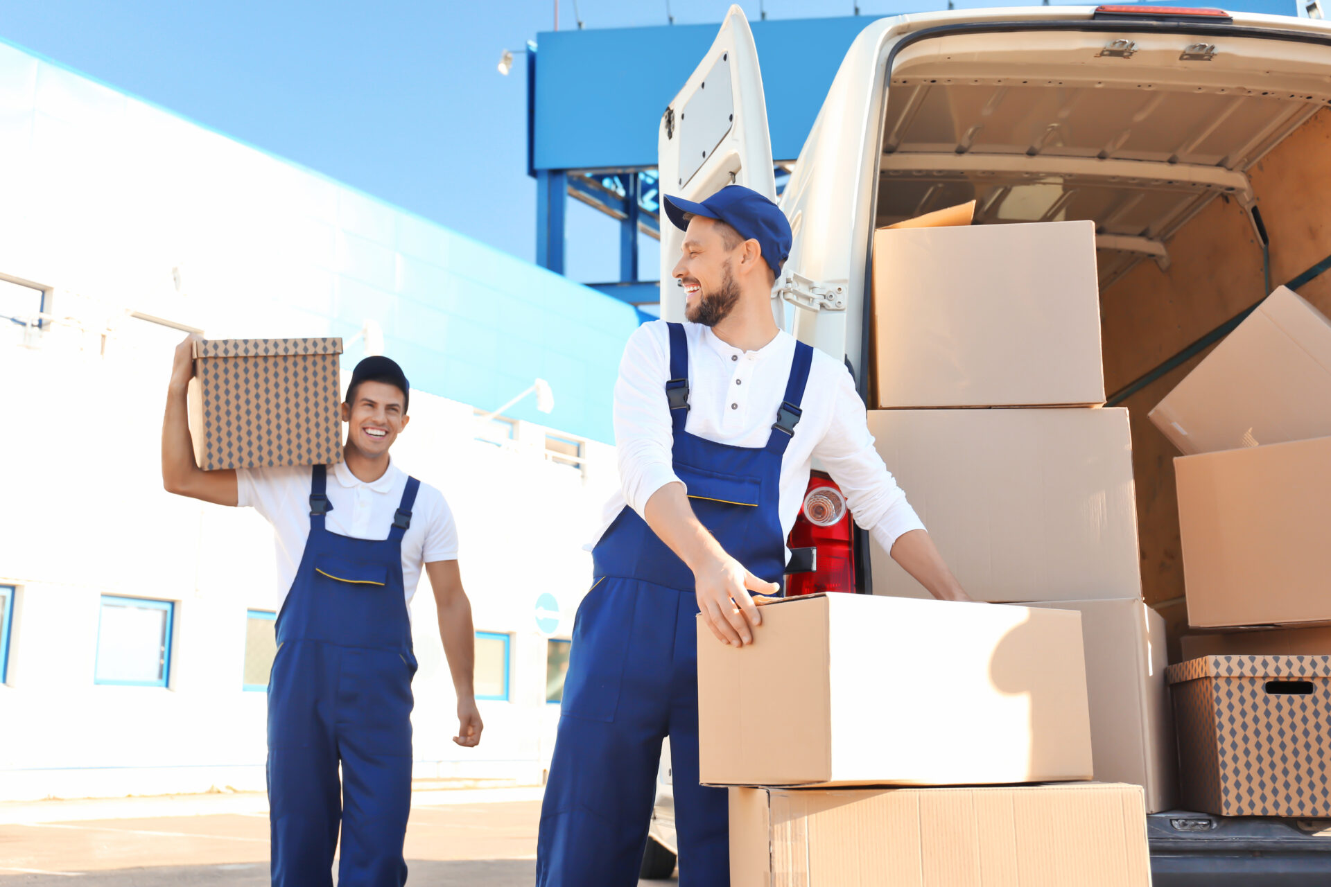 movers unloading boxes from a moving truck