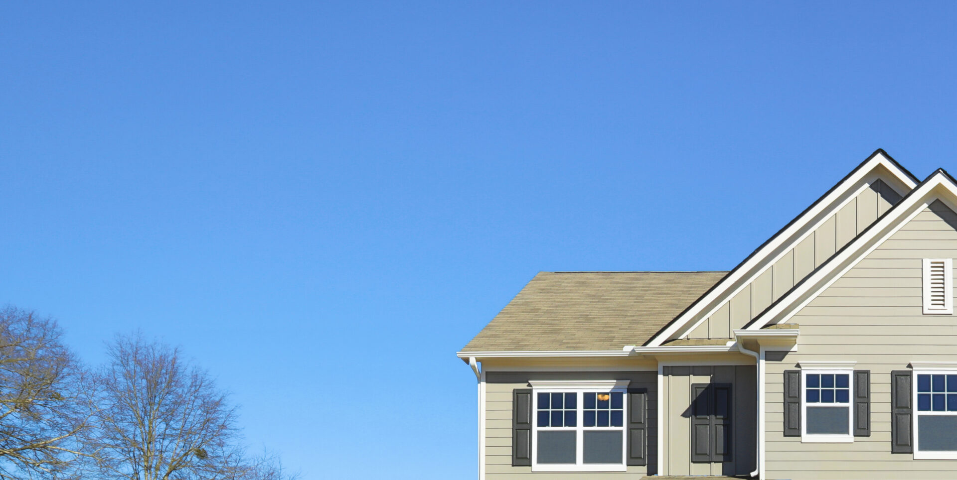 Second story of a house on a clear day.