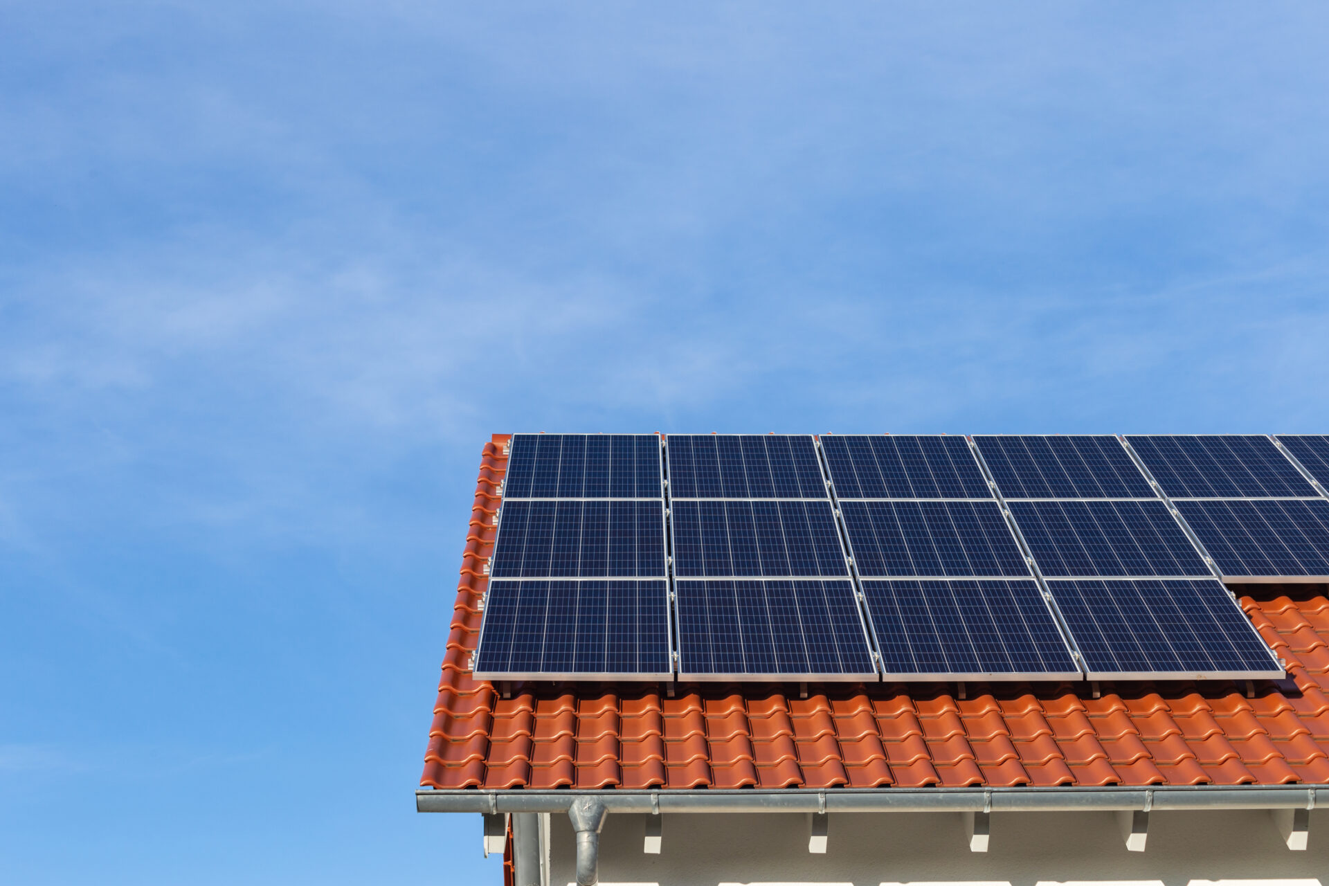 solar panels on a clay roof