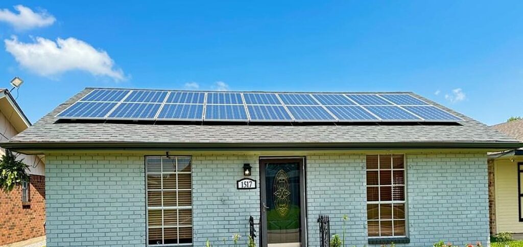 modest single family home in louisiana with solar panels