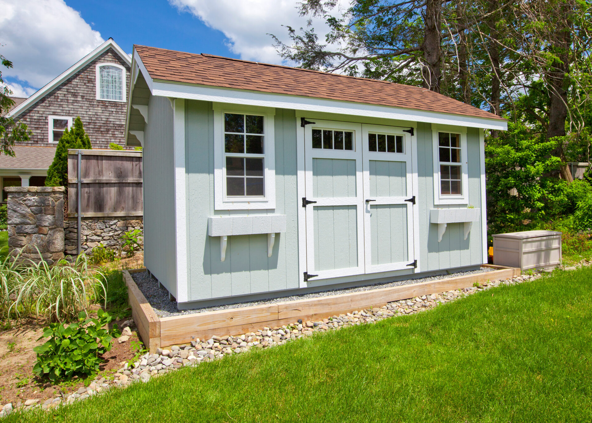 garden shed sitting in bed of rocks