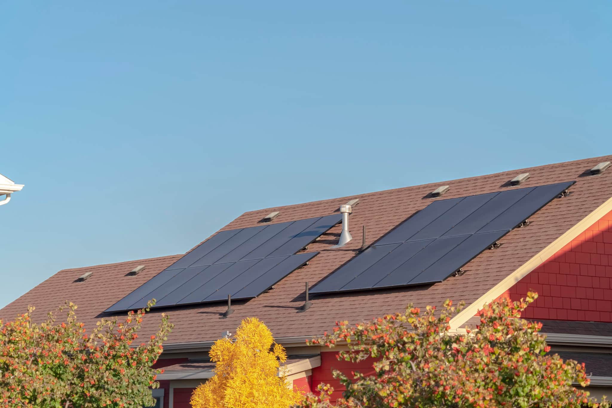 Photovoltaic solar panels on a house roof for converting the energy of the sun into green electricity