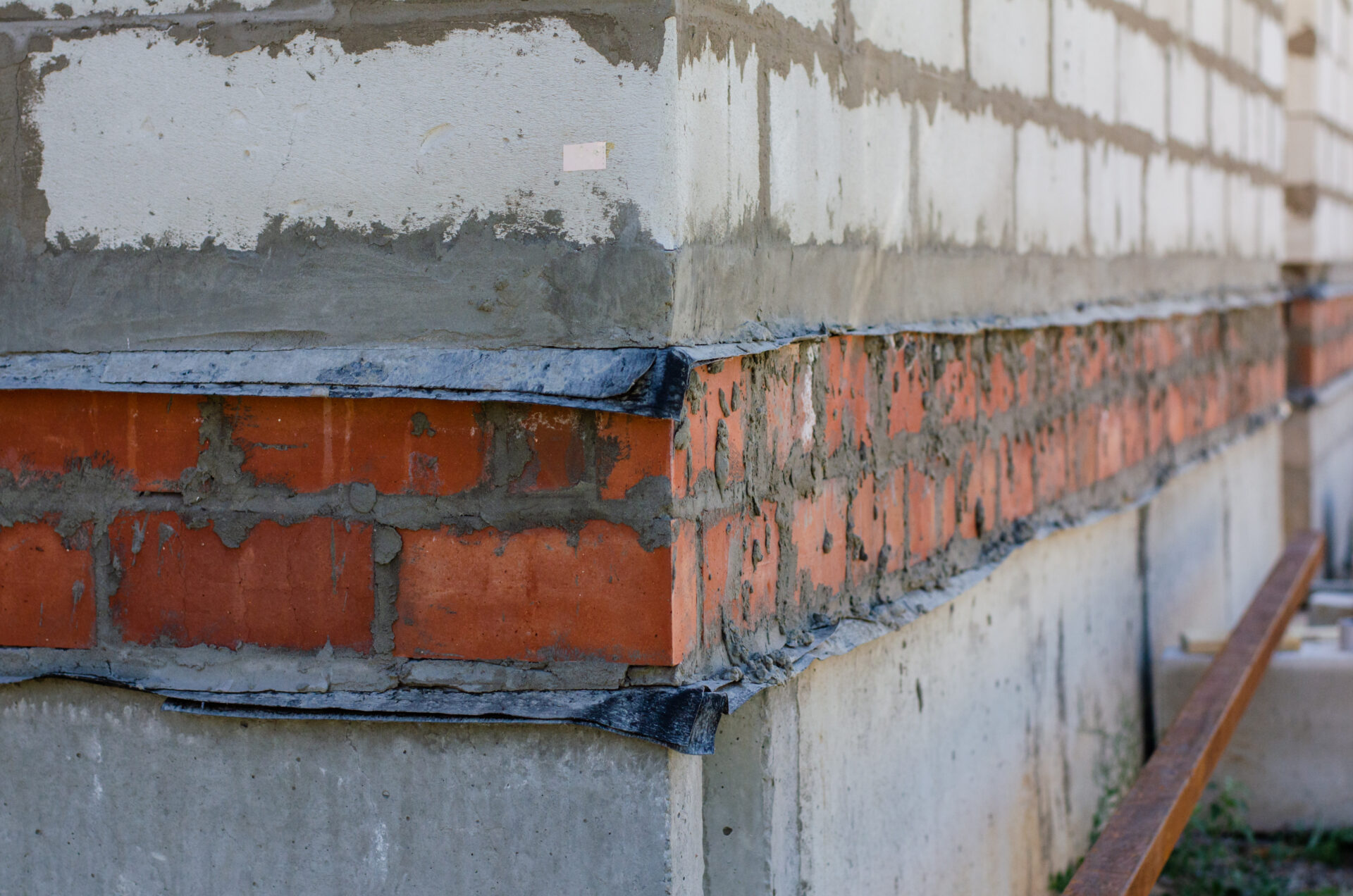 A corner of an unfinished house with aerated concrete foundation