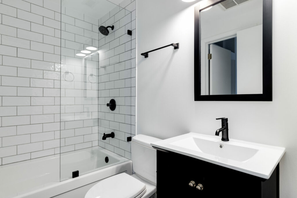 Modern bathroom with tiled shower.