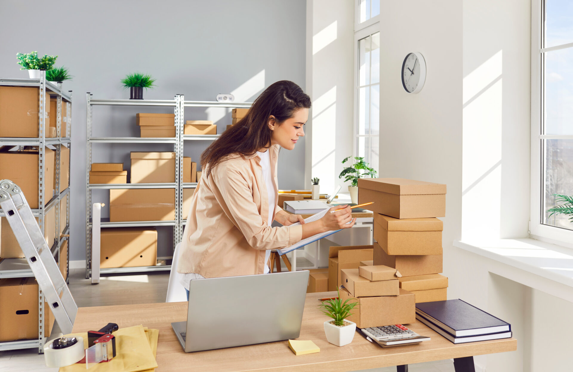 woman creating a moving checklist