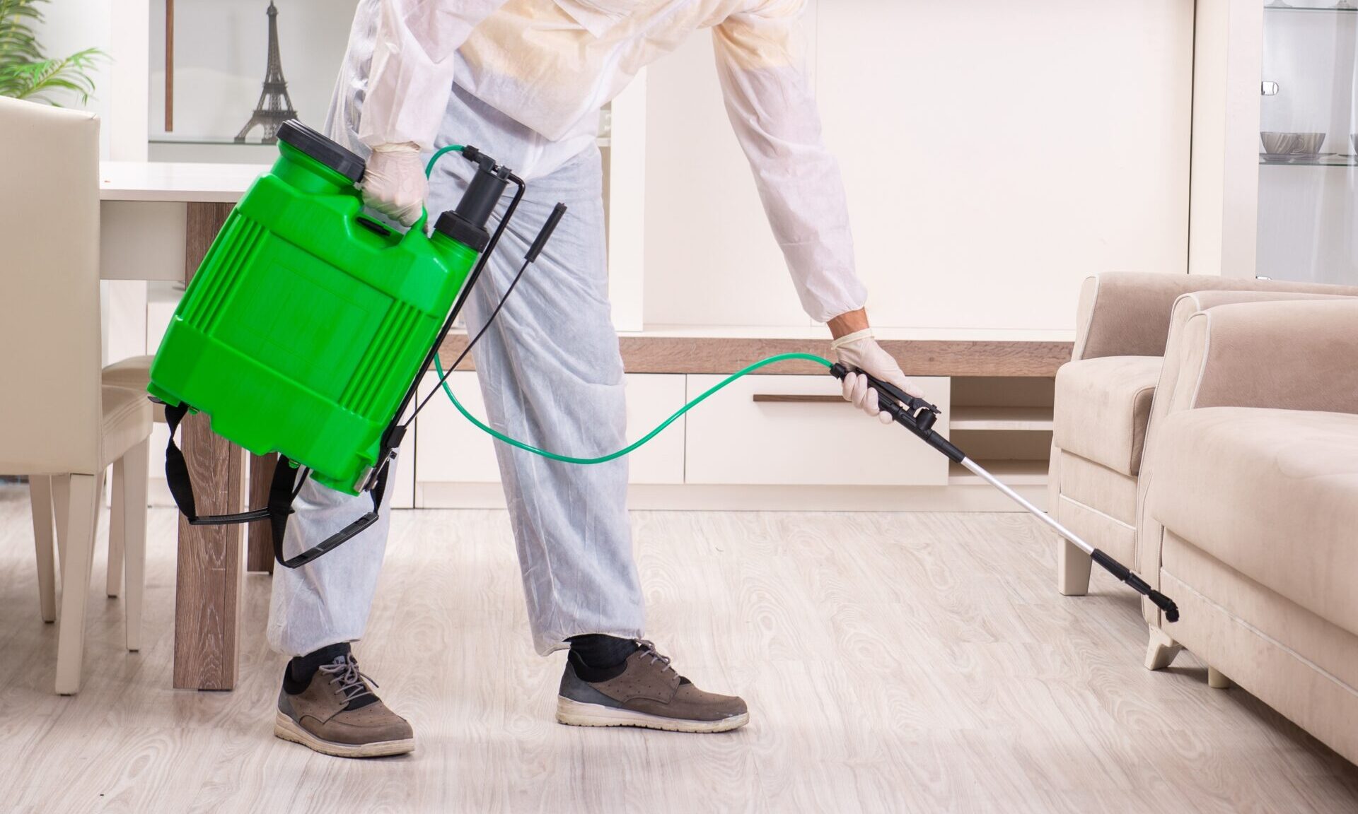pest control contractor working in apartment