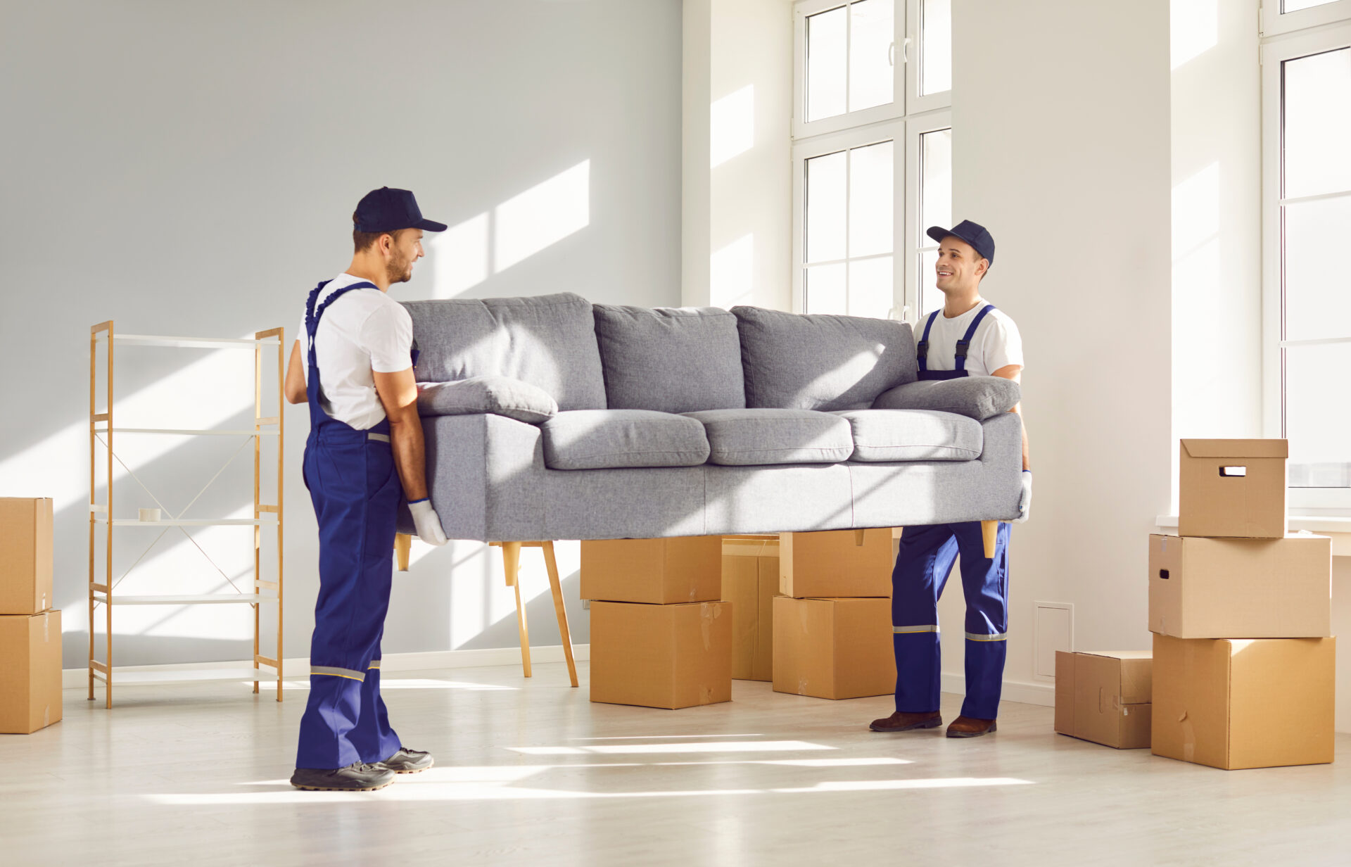 two movers picking up a sofa