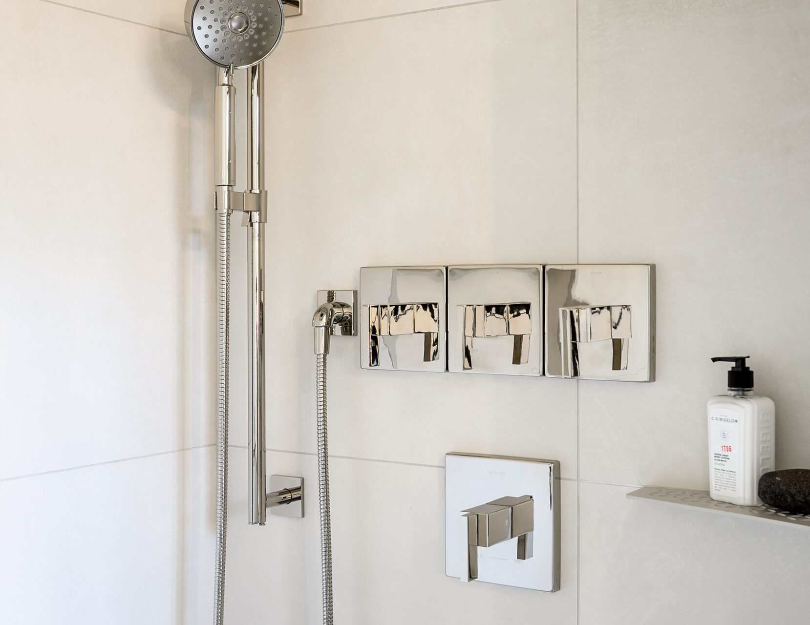plumber installs diverter on shower faucet valve