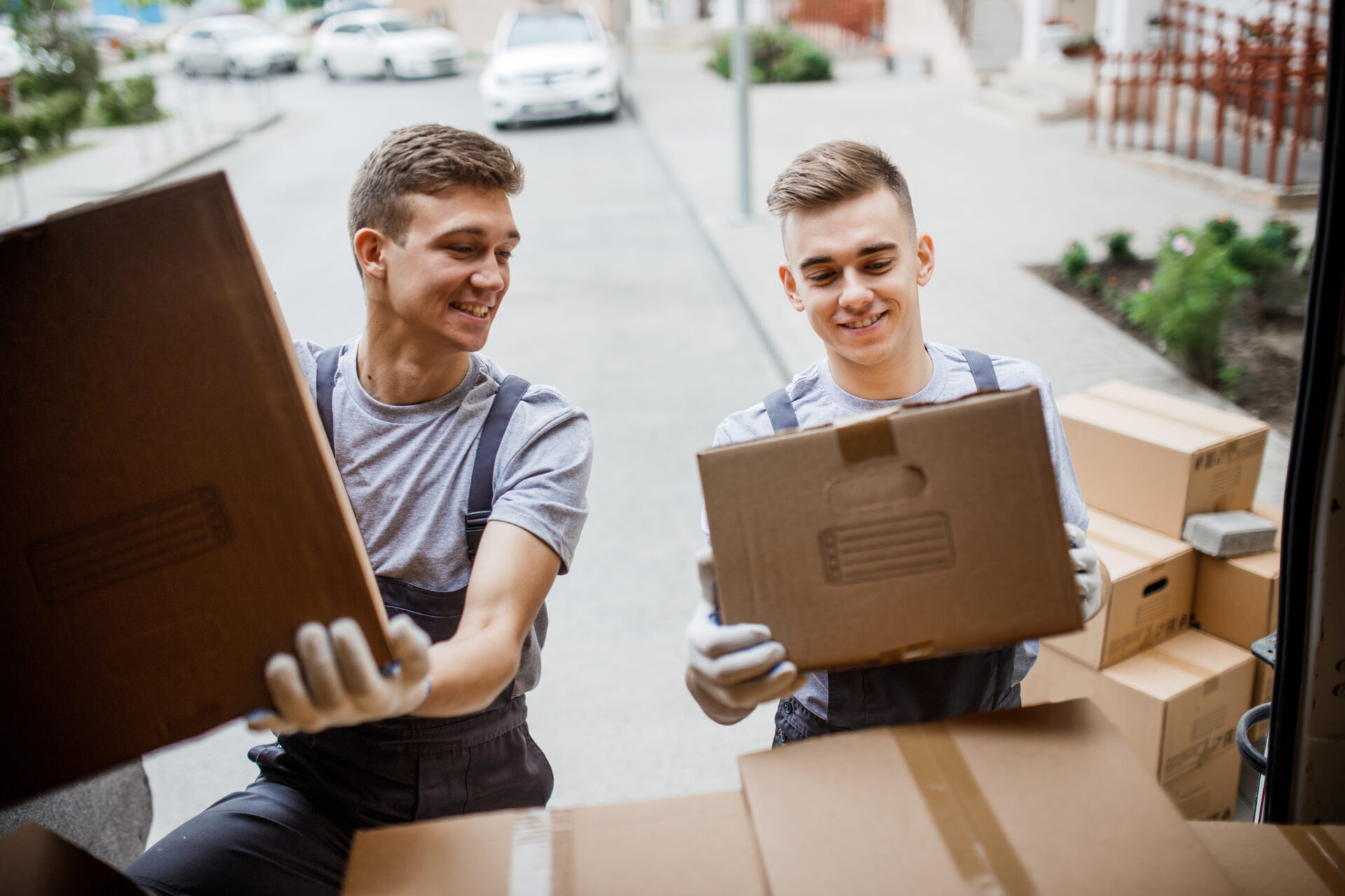 professional movers loading boxes in a moving truck