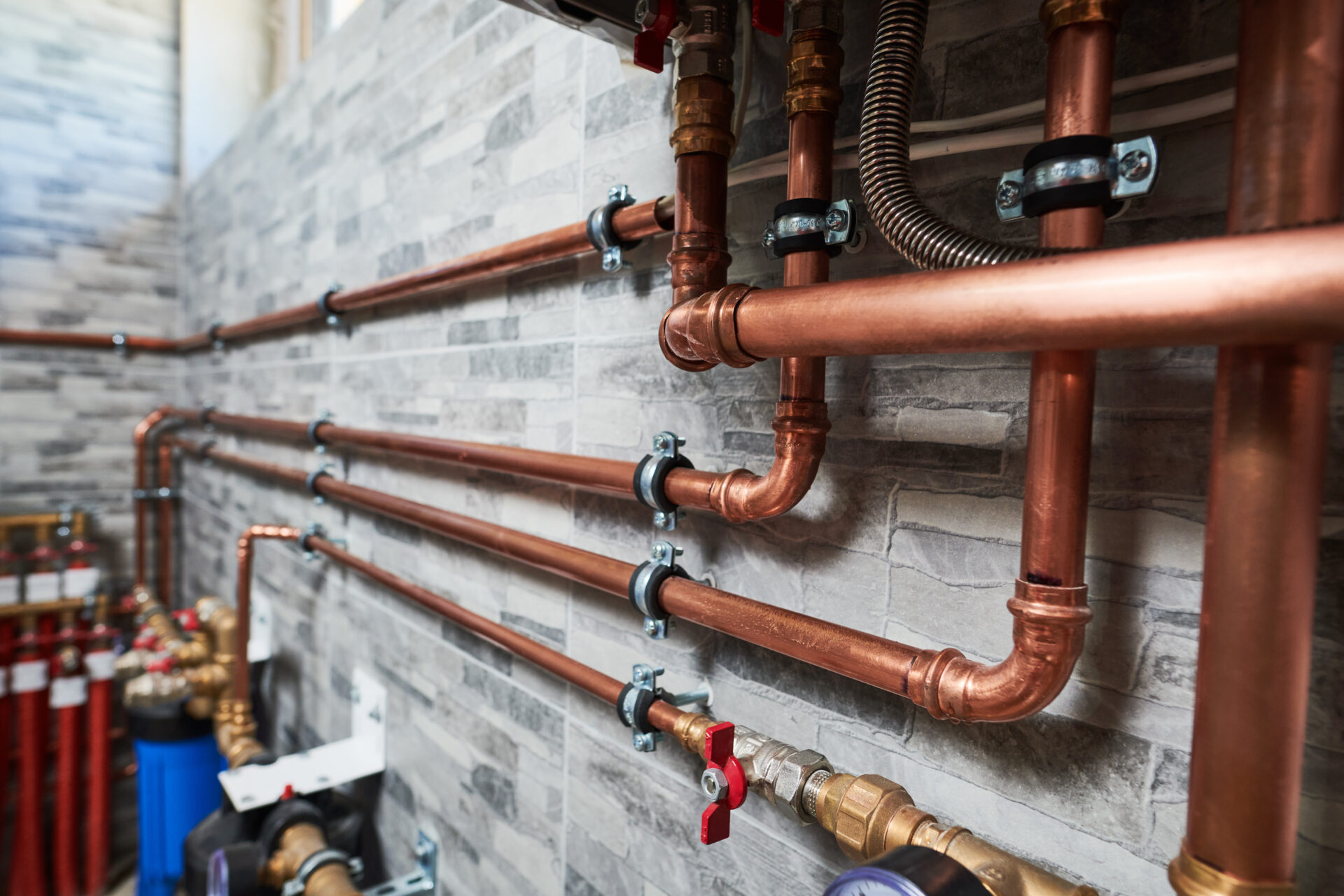 close-up of copper pipes in a house basement
