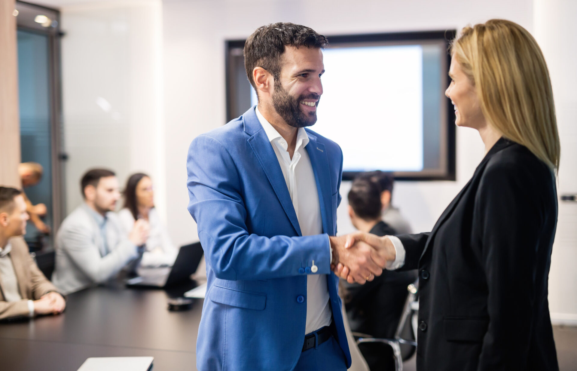 shaking hands after getting a new job