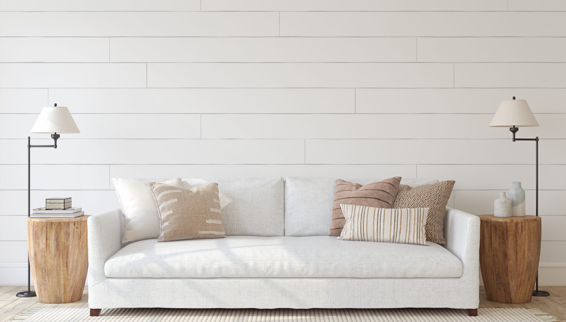 Modern living-room interior with a white couch against a shiplap wall