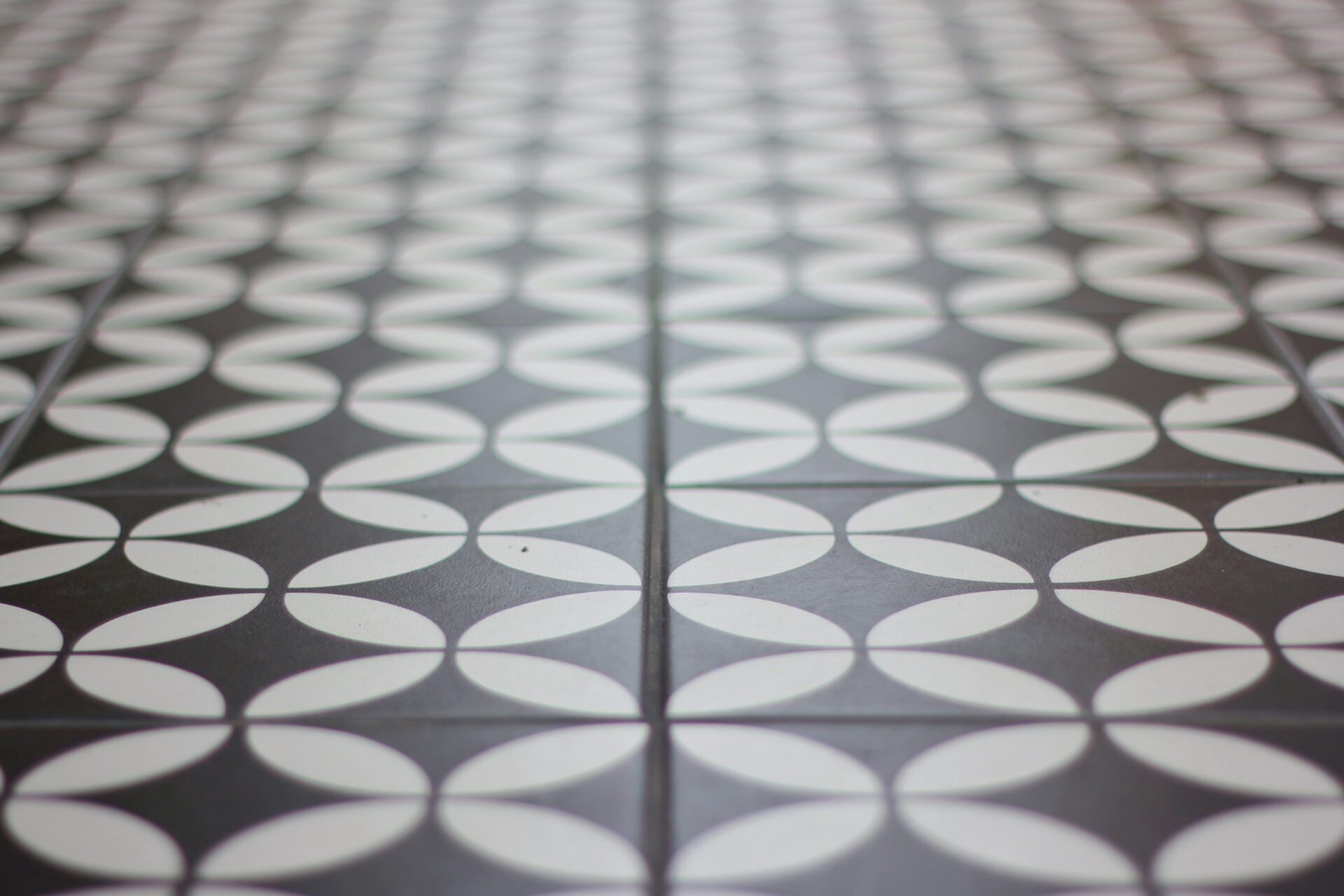 Tiled floor with alternating black and white curves