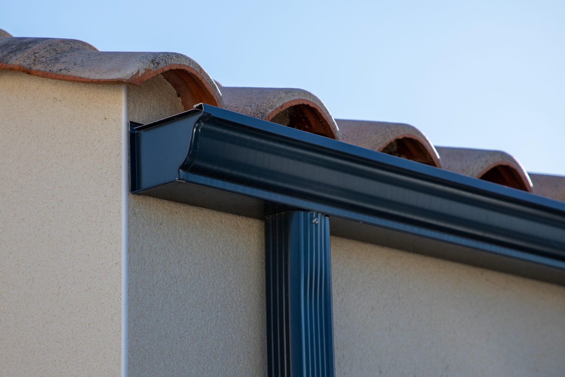 Black K-style gutter system on a house.