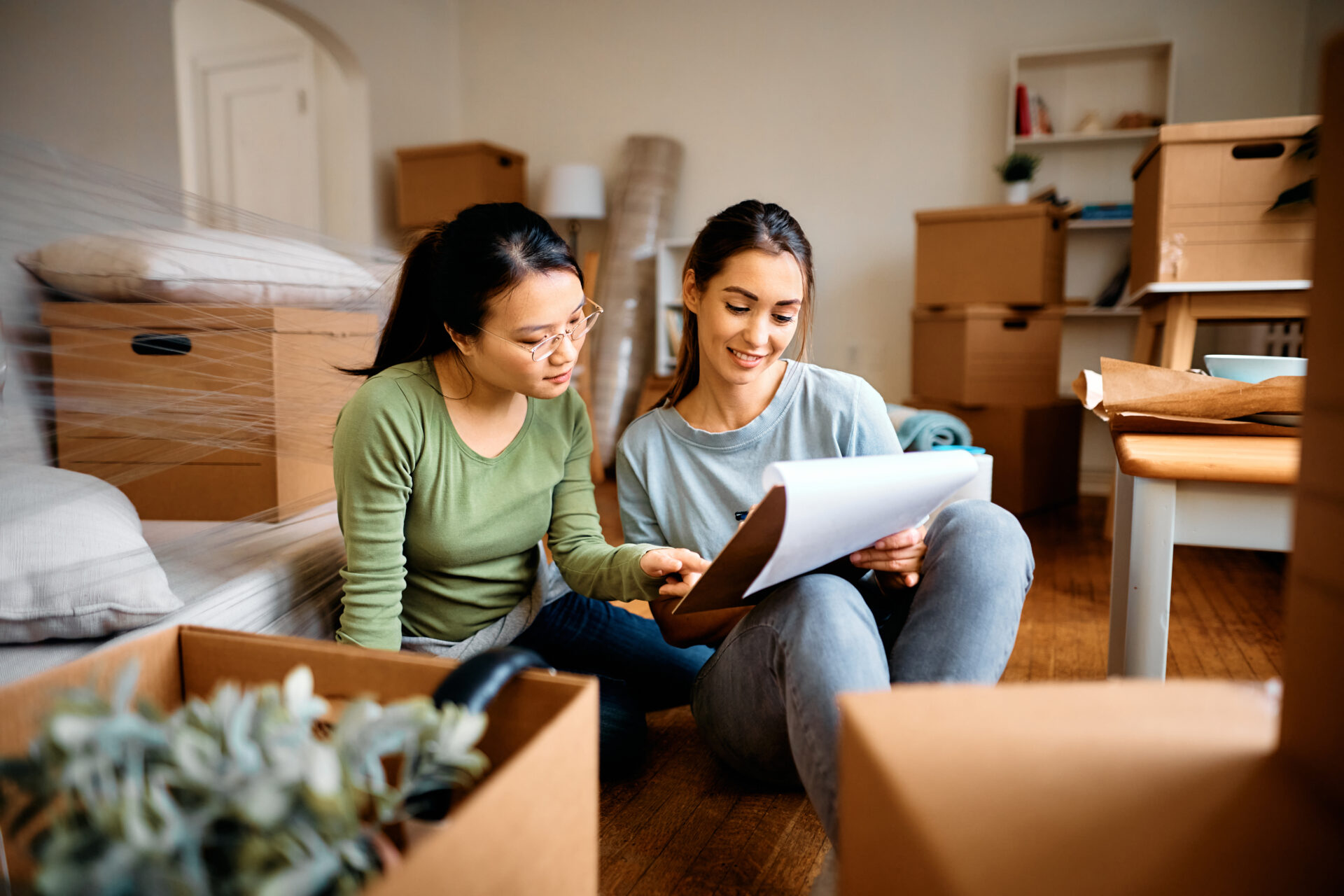 Young women creating a moving budget