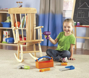 Happy kid playing with toys.