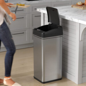 Person opening trash can to throw away kitchen garbage.
