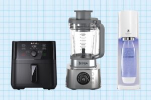 An image showcases three kitchen appliances on a blue grid background: a sleek black digital air fryer, a modern silver blender with a clear pitcher, and a streamlined white soda maker with a bottle in place.