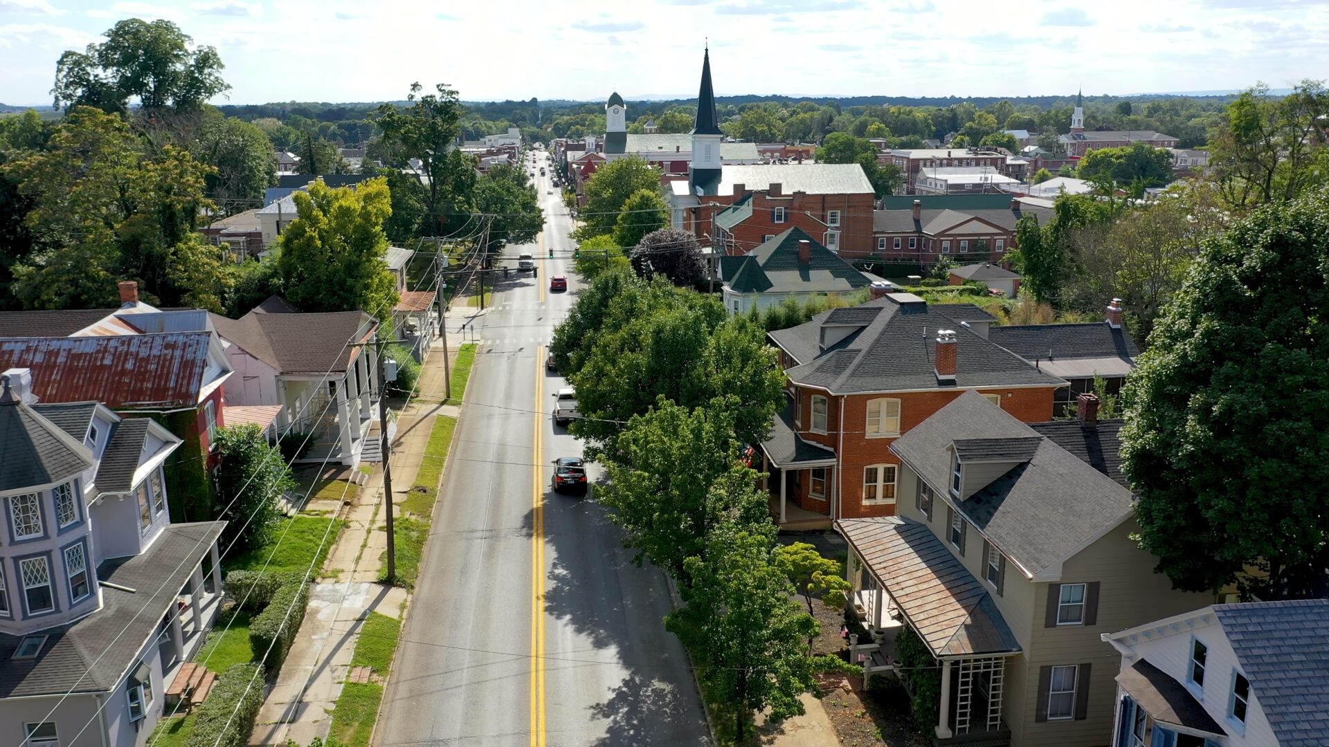 Neighborhood homes on main street in Charles Town, West Virginia on a beautiful sunny day.