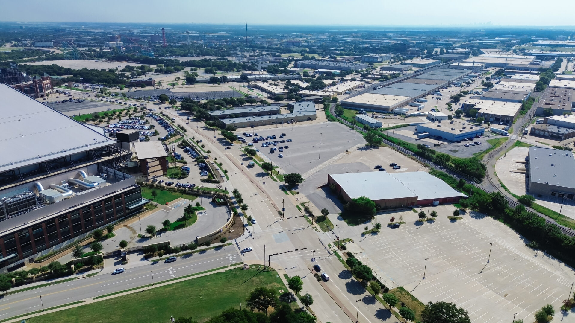 Industrial warehouse space near entertainment district in manufacturing zoning South of Arlington, Texas, rapidly developing supply chain hub logistics in established business community, aerial. USA