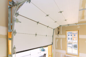 In construction of new home, rolling shutters plastic garage doors were installed.